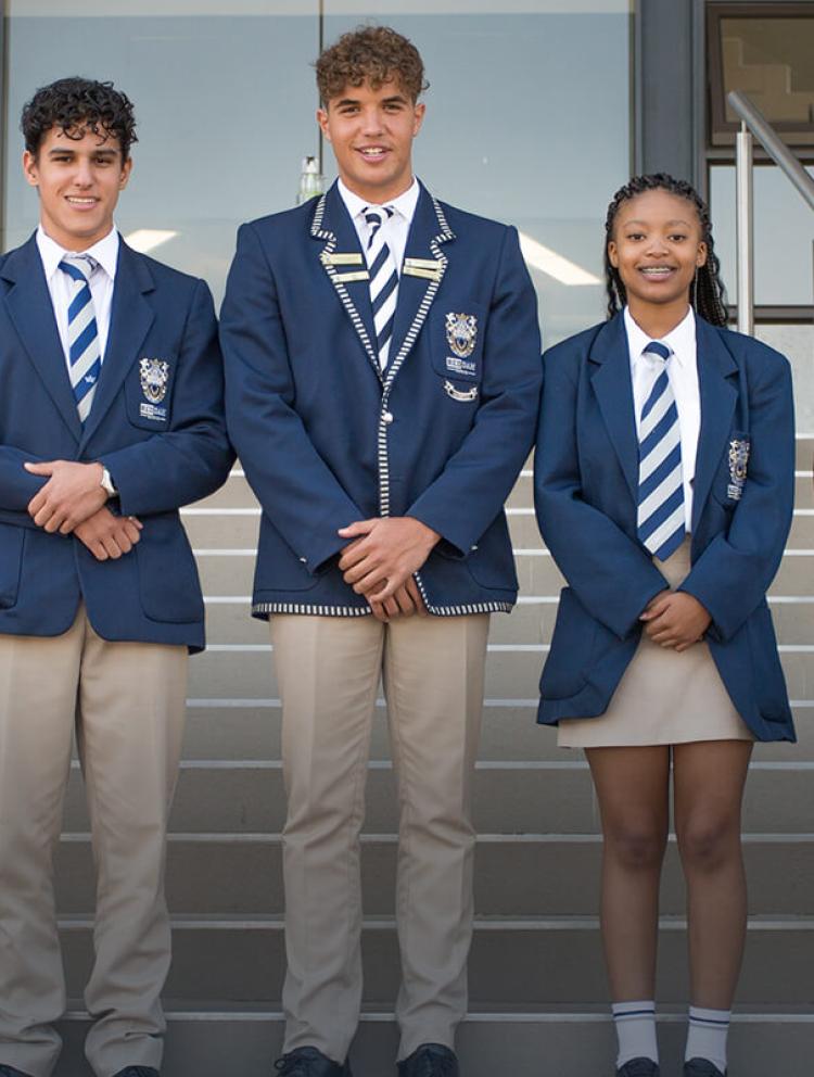 Students in uniform on stairs