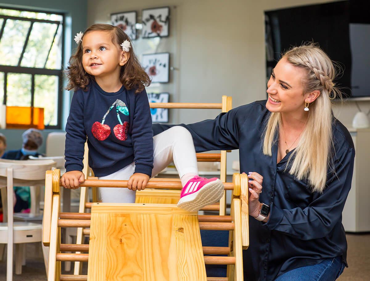 Teacher with kindergarten student