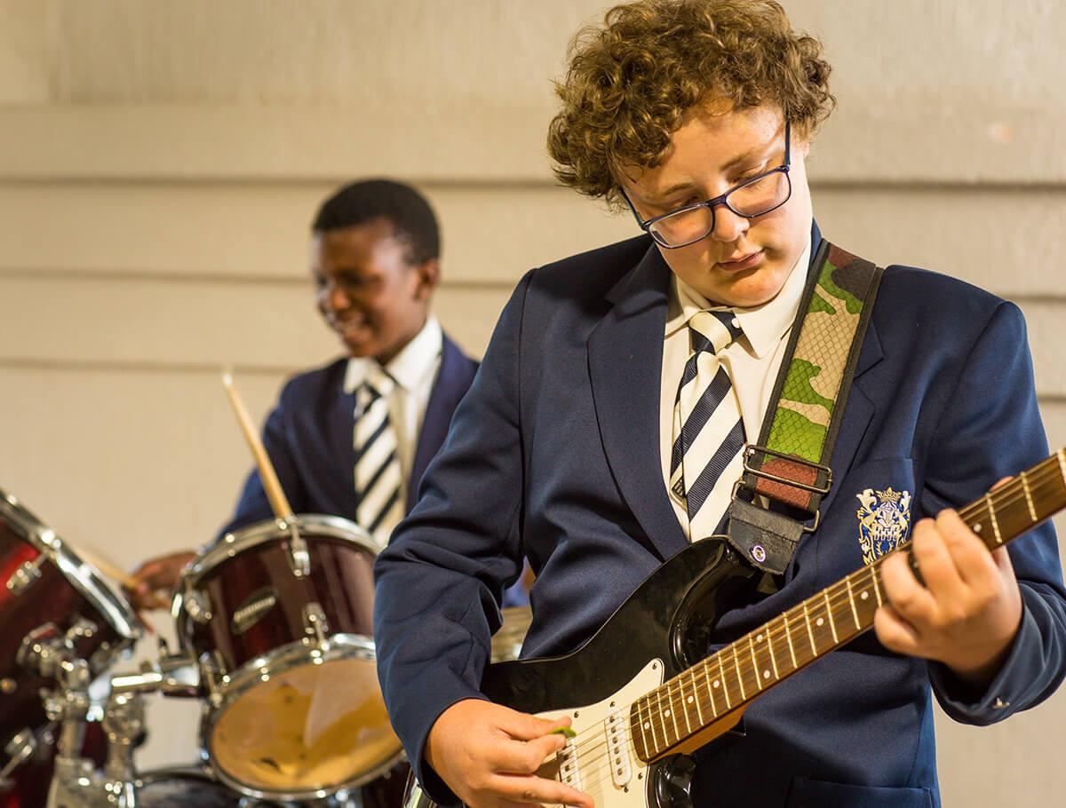 Student playing guitar