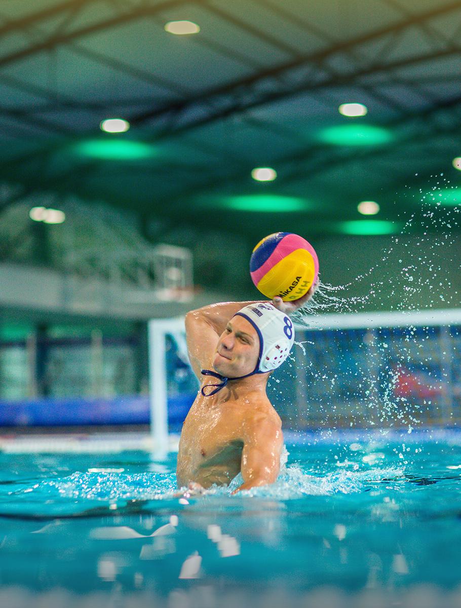 Student playing waterpolo