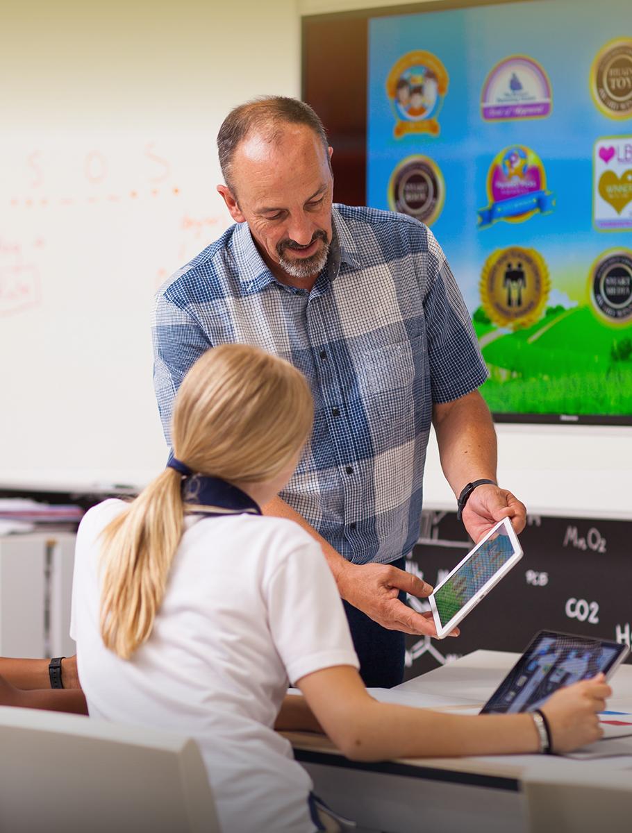 Teacher showing student Ipad